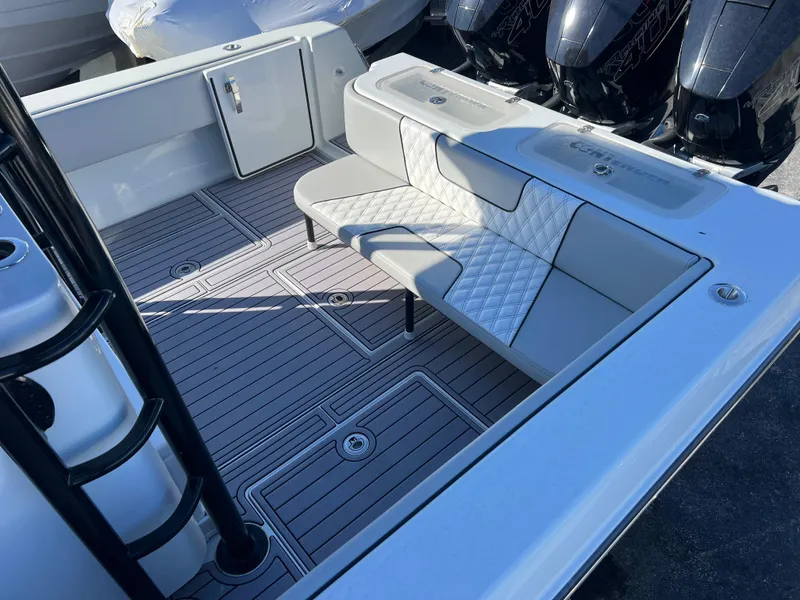 Slide: The Image of 2024 Contender 39 ST Center Console boat interior with cushioned seating and sleek design. - 13