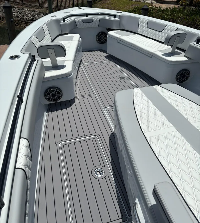 Slide: The Image of 2024 Contender 39 ST Center Console boat with spacious seating and sleek design. - 14