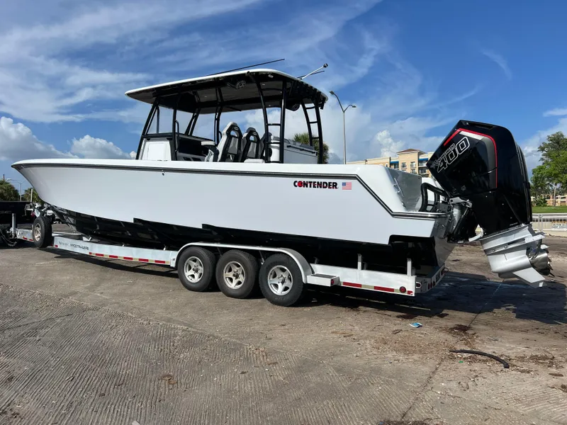 Slide: The Image of 2024 Contender 39 ST Center Console boat on a trailer. - 22