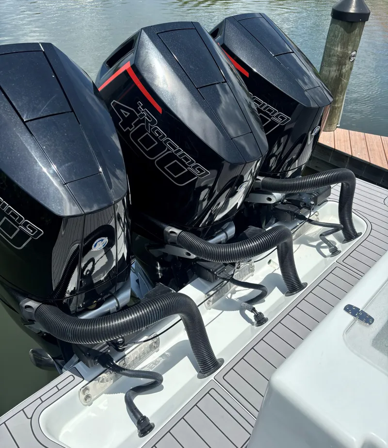 Slide: The Image of 2024 Contender 39 ST Center Console with triple Mercury 400 outboard engines docked. - 26