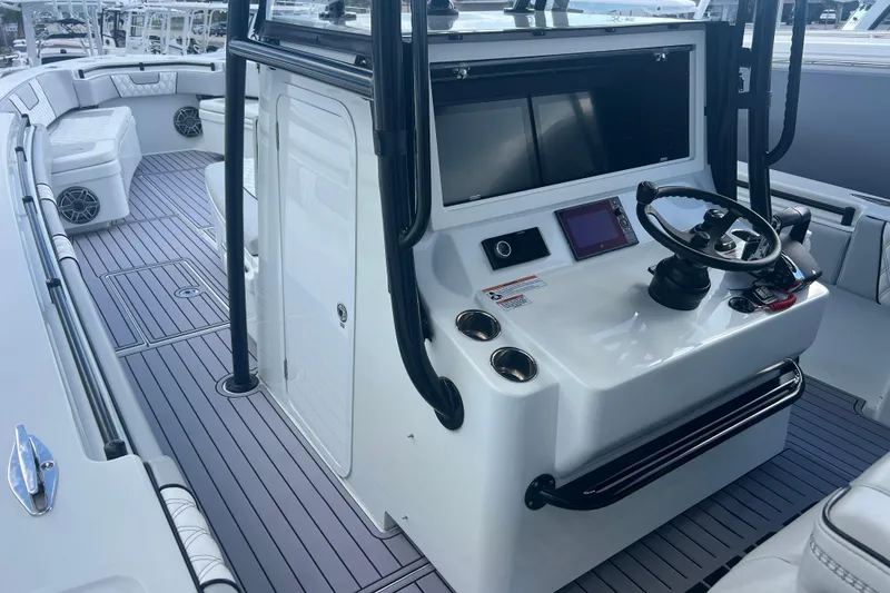 Slide: The Image of 2024 Contender 39 ST boat interior with modern helm and seating. - 6