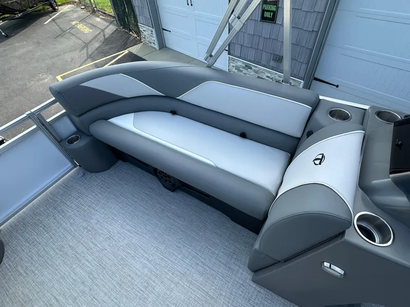 Slide: The Image of 2025 Tahoe Pontoon 2385 Sport 85 Quad Lounger interior seating with cup holders. - 12