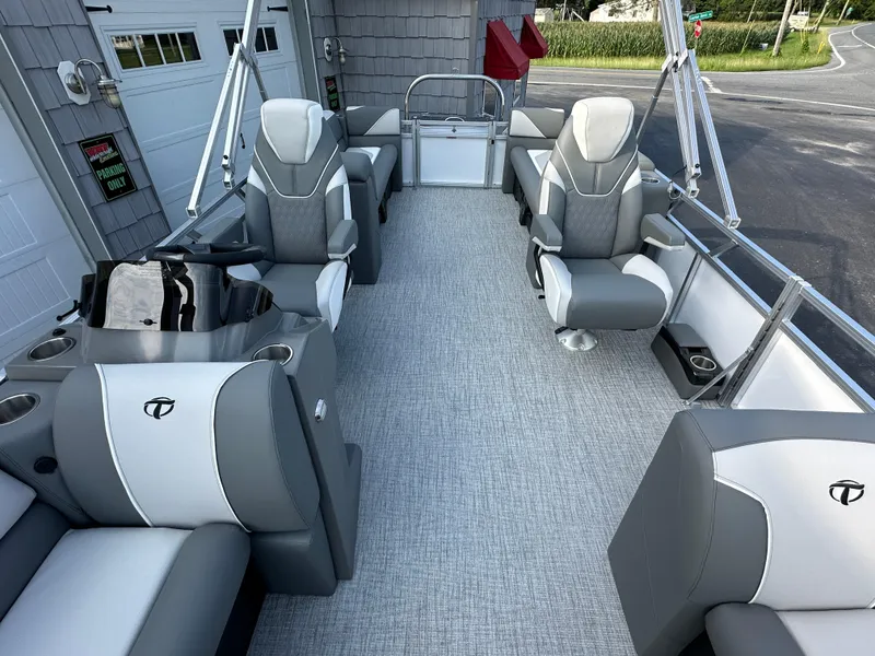 Slide: The Image of 2025 Tahoe Pontoon 2385 Sport 85 Quad Lounger Tri Toon interior with gray and white seating. - 14