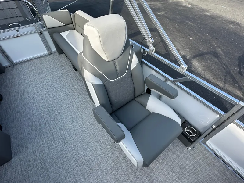 Slide: The Image of 2025 Tahoe Pontoon 2385 Sport 85 Quad Lounger interior with gray seating and armrests. - 16