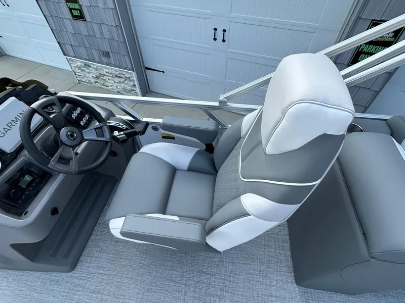 Slide: The Image of 2025 Tahoe Pontoon 2385 Sport 85 Quad Lounger Tri Toon driver's seat and console. - 22