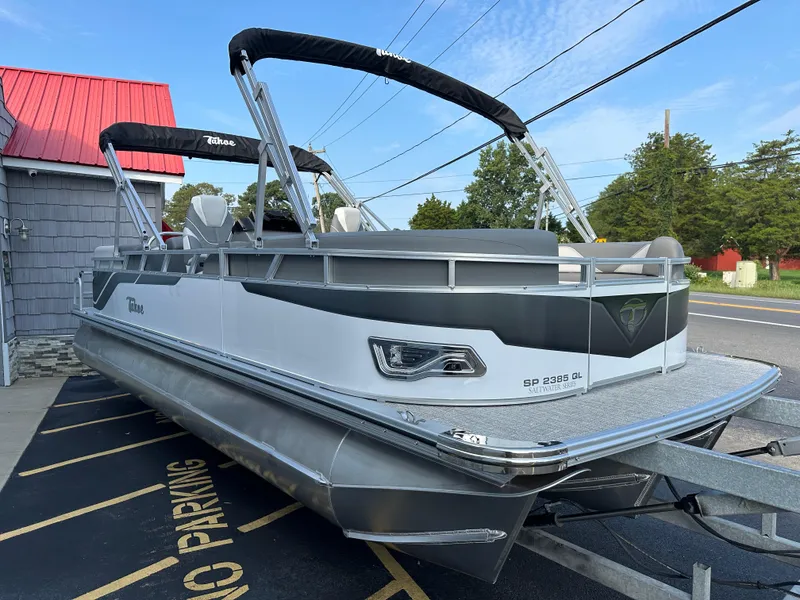Slide: The Image of 2025 Tahoe Pontoon 2385 Sport 85 Quad Lounger Tri Toon in parking lot. - 7