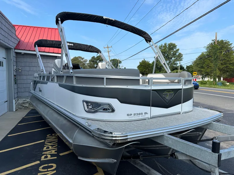 Slide: The Image of 2025 Tahoe Pontoon 2385 Sport 85 Quad Lounger Tri Toon on trailer. - 8