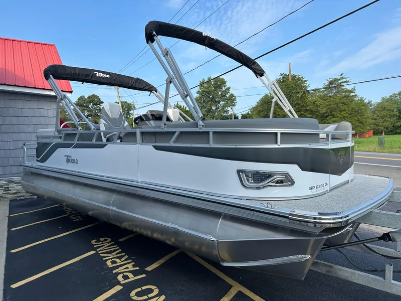 Slide: The Image of 2025 Tahoe Pontoon 2385 Sport 85 Quad Lounger Tri Toon in parking lot. - 9