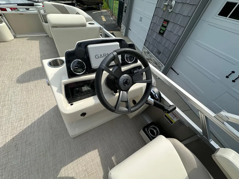 Slide: The Image of 2025 Tahoe Pontoon 2385 Sport 85, Rear Fish, Tri Toon, Sport Performance helm station. - 18