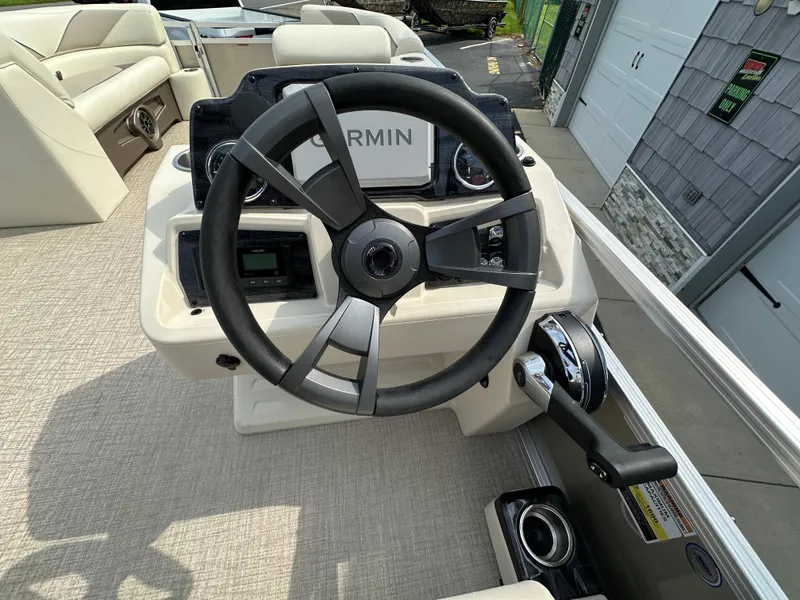 Slide: The Image of 2025 Tahoe Pontoon 2385 Sport 85 steering console with Garmin navigation system. - 19