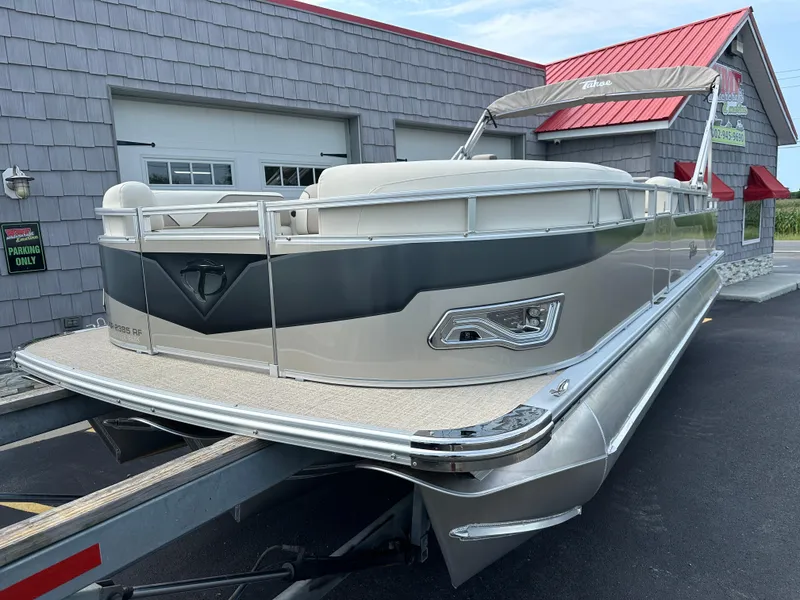 Slide: The Image of 2025 Tahoe Pontoon 2385 Sport 85, Rear Fish, Tri Toon, Sport Performance boat on trailer. - 3