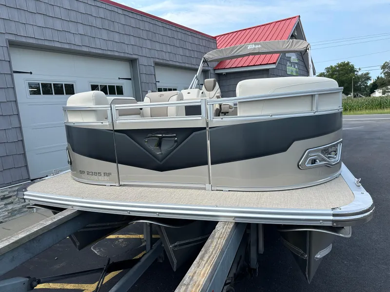 Slide: The Image of 2025 Tahoe Pontoon 2385 Sport 85, Rear Fish, Tri Toon, Sport Performance boat on trailer. - 4