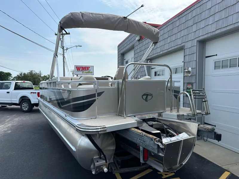 Slide: The Image of 2025 Tahoe Pontoon 2385 Sport 85, Rear Fish, Tri Toon, Sport Performance boat on trailer. - 6