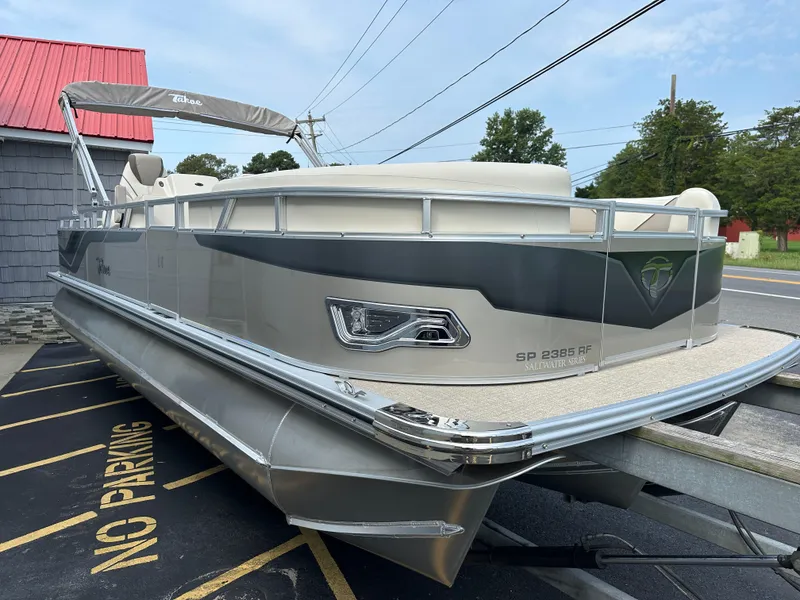 Slide: The Image of 2025 Tahoe Pontoon 2385 Sport 85, Rear Fish, Tri Toon, Sport Performance boat on trailer. - 7