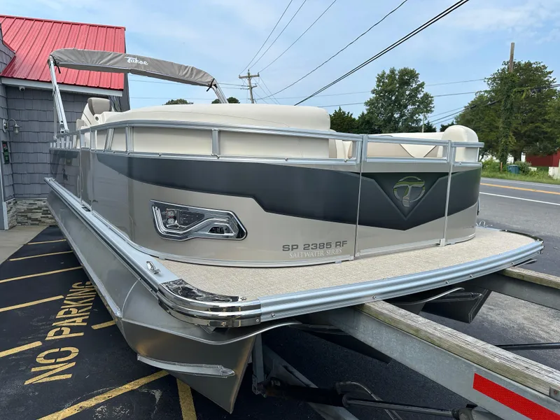 Slide: The Image of 2025 Tahoe Pontoon 2385 Sport 85, Rear Fish, Tri Toon, Sport Performance on trailer. - 8