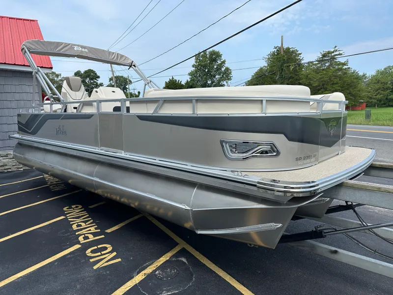 Slide: The Image of 2025 Tahoe Pontoon 2385 Sport 85, Rear Fish, Tri Toon, Sport Performance boat on trailer. - 9