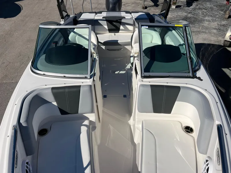 Slide: The Image of 2024 Chaparral 21 SSi OB boat interior with open bow seating and windshield. - 15