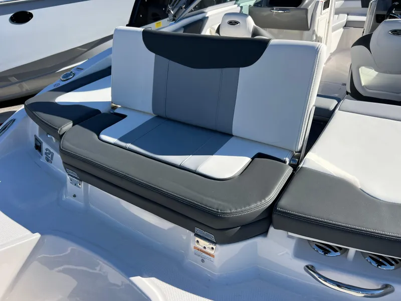 Slide: The Image of 2024 Chaparral 21 SSi OB boat interior with gray and white seating. - 19