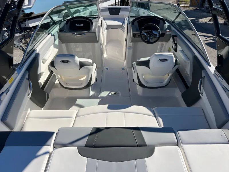 Slide: The Image of 2024 Chaparral 21 SSi OB boat interior with modern seating and sleek design. - 8