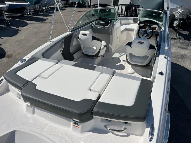 Slide: The Image of 2024 Chaparral 19 SSi OB boat interior with sleek seating and modern dashboard design. - 3