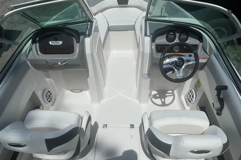 Slide: The Image of 2024 Chaparral 19 SSi OB boat interior with dual seats and modern dashboard. - 5