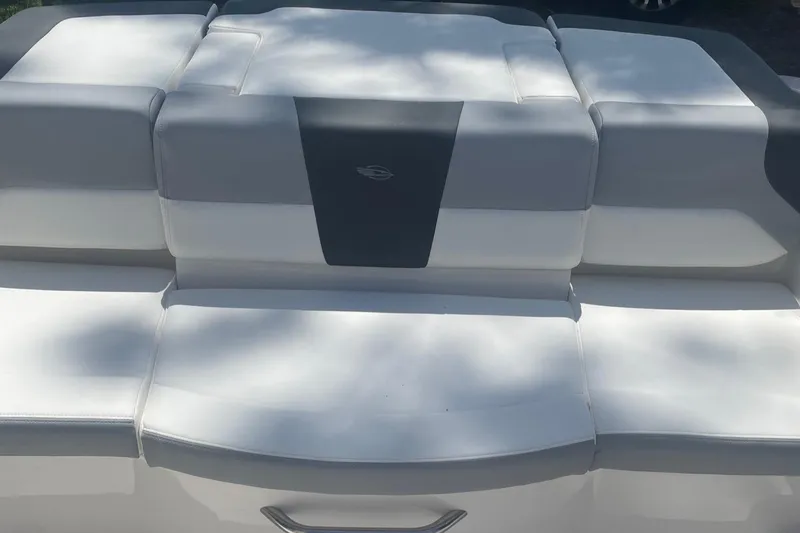 Slide: The Image of 2024 Chaparral 19 SSi OB boat seating area with white and gray upholstery. - 9