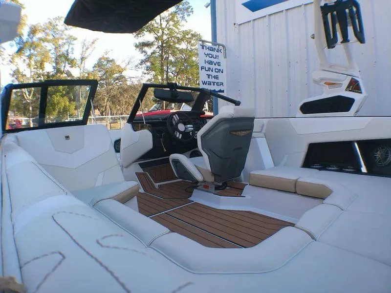 Slide: The Image of 2023 Nautique Super Air GS20 boat interior with sleek seating and modern dashboard. - 4