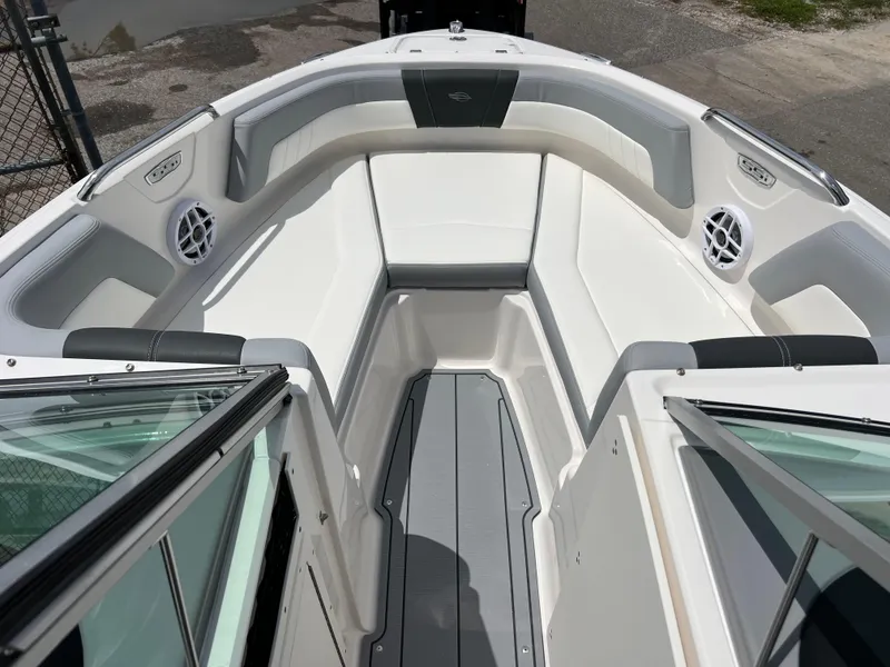 Slide: The Image of 2024 Chaparral 21 SSi OB boat interior with white and gray seating. - 12