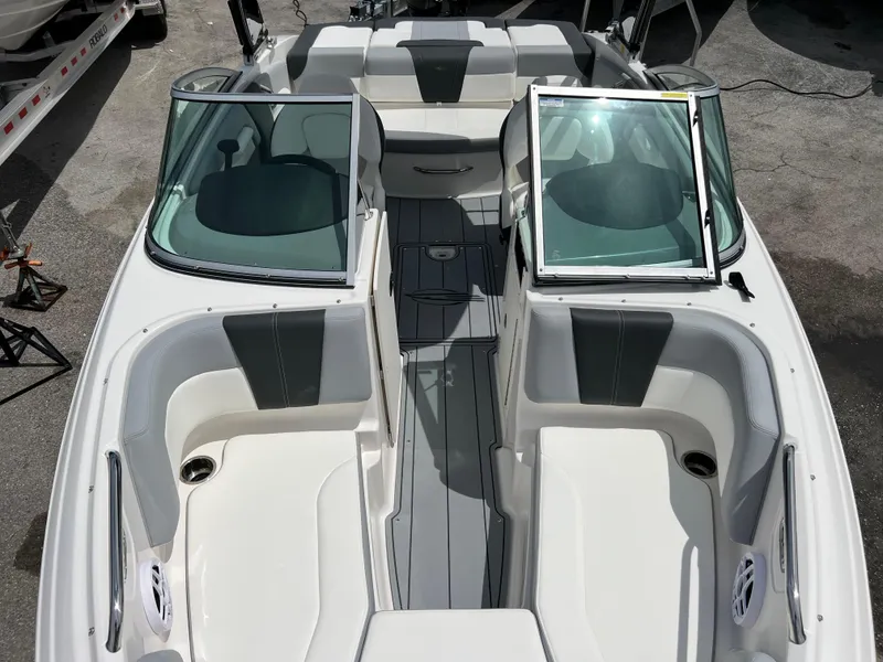 Slide: The Image of 2024 Chaparral 21 SSi OB boat interior with open bow seating and windshield. - 13
