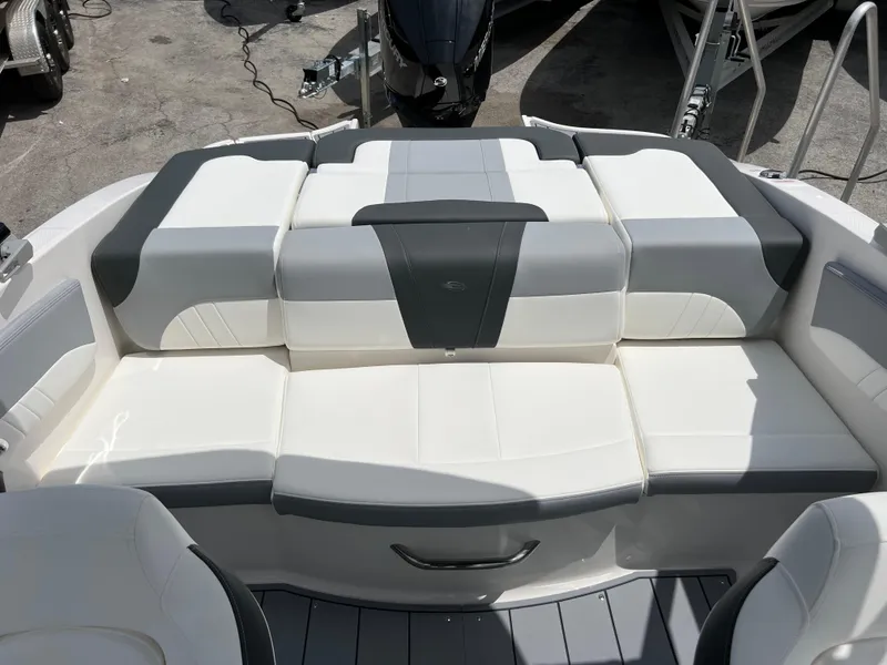Slide: The Image of 2024 Chaparral 21 SSi OB boat interior seating with white and gray upholstery. - 16