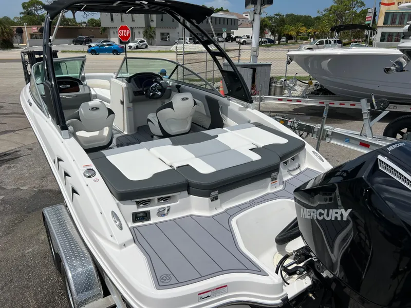 Slide: The Image of 2024 Chaparral 21 SSi OB boat with Mercury outboard engine, rear seating view. - 4