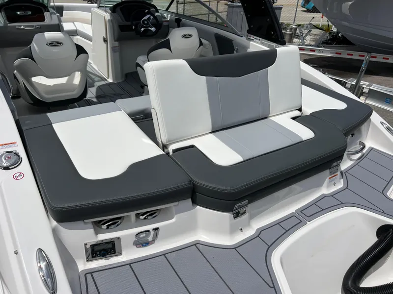 Slide: The Image of 2024 Chaparral 21 SSi OB boat interior with gray and white seating. - 7