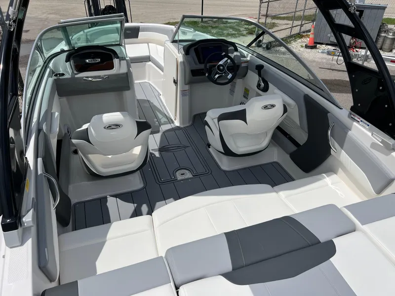 Slide: The Image of 2024 Chaparral 21 SSi OB boat interior with modern seating and steering console. - 8