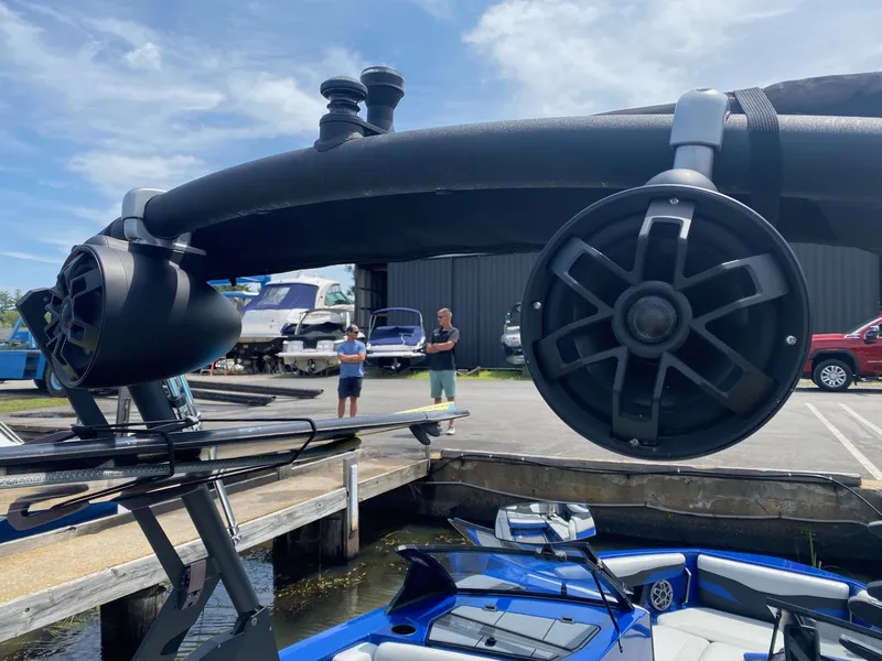 Slide: The Image of Close-up of 2022 Axis T220 boat speakers at a marina. - 10