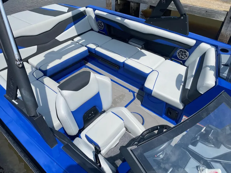 Slide: The Image of 2022 Axis T220 boat interior with blue and white seating. - 12