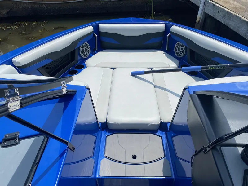Slide: The Image of 2022 Axis T220 boat with blue and white interior, bow seating area. - 4