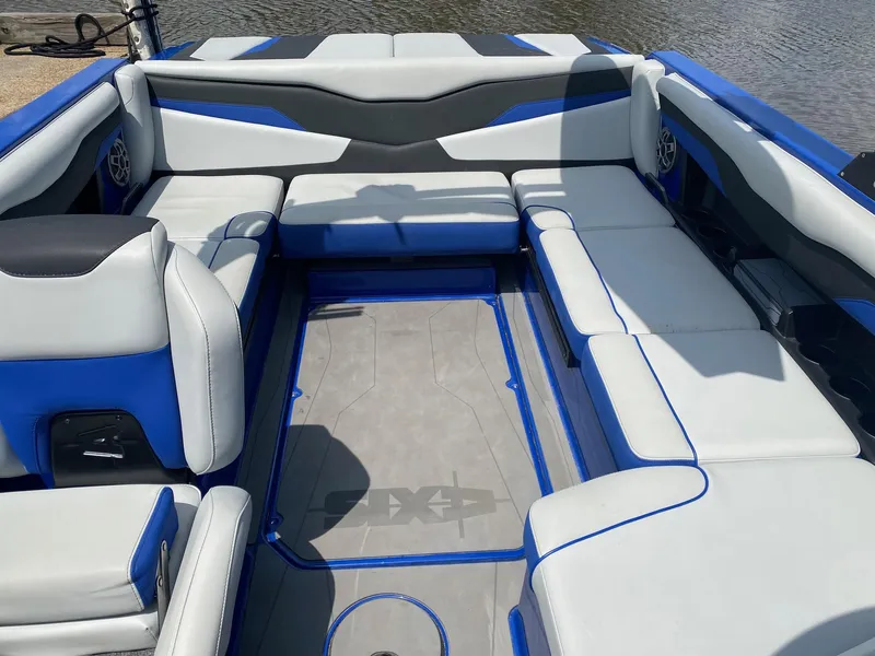 Slide: The Image of 2022 Axis T220 boat interior with blue and gray seating. - 7