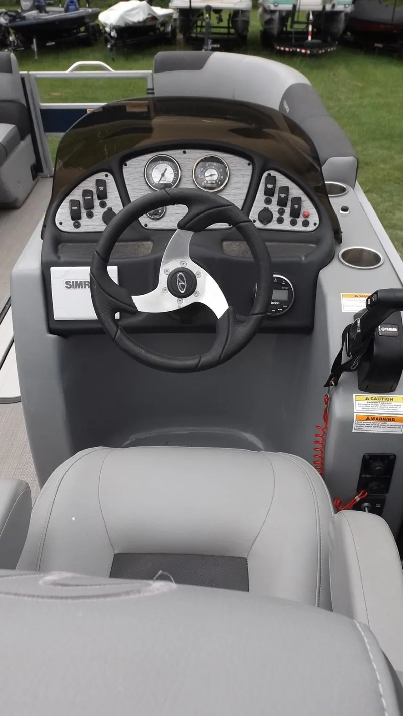 Slide: The Image of 2021 Veranda Fish VF22F2 boat dashboard with steering wheel and control panel. - 10