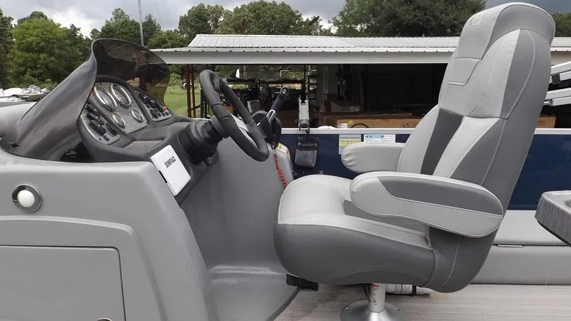 Slide: The Image of 2021 Veranda Fish VF22F2 boat interior with captain's chair and control panel. - 14