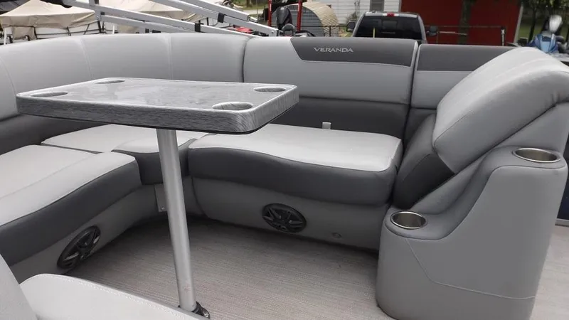 Slide: The Image of 2021 Veranda Fish VF22F2 boat interior with gray seating and table. - 15