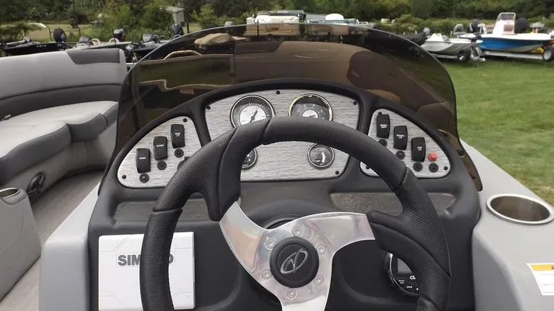 Slide: The Image of 2021 Veranda Fish VF22F2 boat dashboard with steering wheel and control panel. - 16