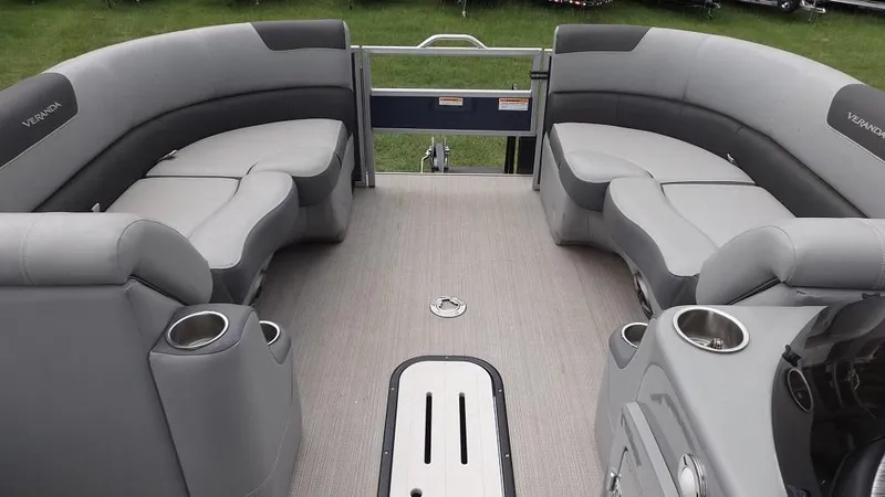 Slide: The Image of 2021 Veranda Fish VF22F2 pontoon boat interior with gray seating and cup holders. - 17