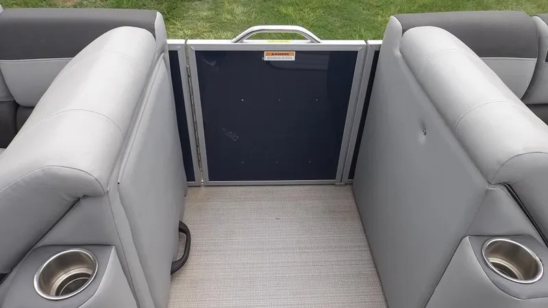 Slide: The Image of 2021 Veranda Fish VF22F2 boat interior with gray seating and cup holders. - 18