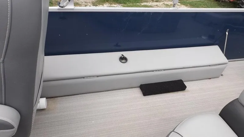 Slide: The Image of 2021 Veranda Fish VF22F2 boat interior with gray seating and blue side panel. - 20