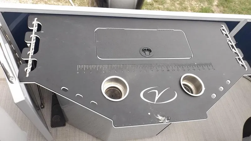 Slide: The Image of 2021 Veranda Fish VF22F2 boat console with cup holders and measuring ruler. - 21