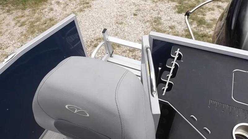 Slide: The Image of 2021 Veranda Fish VF22F2 boat interior with fishing rod holders and seating. - 22