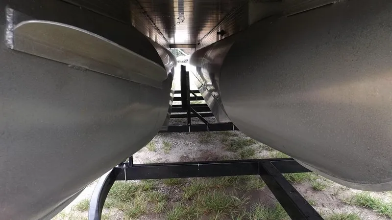 Slide: The Image of Underneath view of a 2021 Veranda Fish VF22F2 pontoon boat on a trailer. - 25