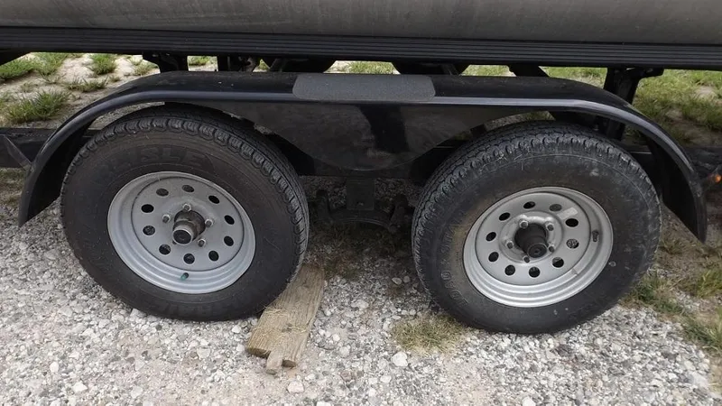 Slide: The Image of 2021 Veranda Fish VF22F2 trailer wheels on gravel. - 27