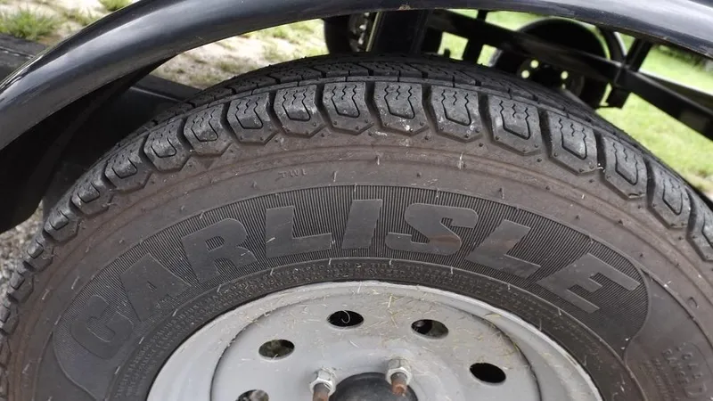 Slide: The Image of Close-up of a Carlisle tire on a 2021 Veranda Fish VF22F2. - 28