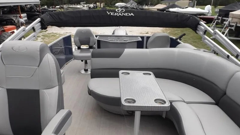 Slide: The Image of 2021 Veranda Fish VF22F2 pontoon boat interior with gray seating and table. - 5